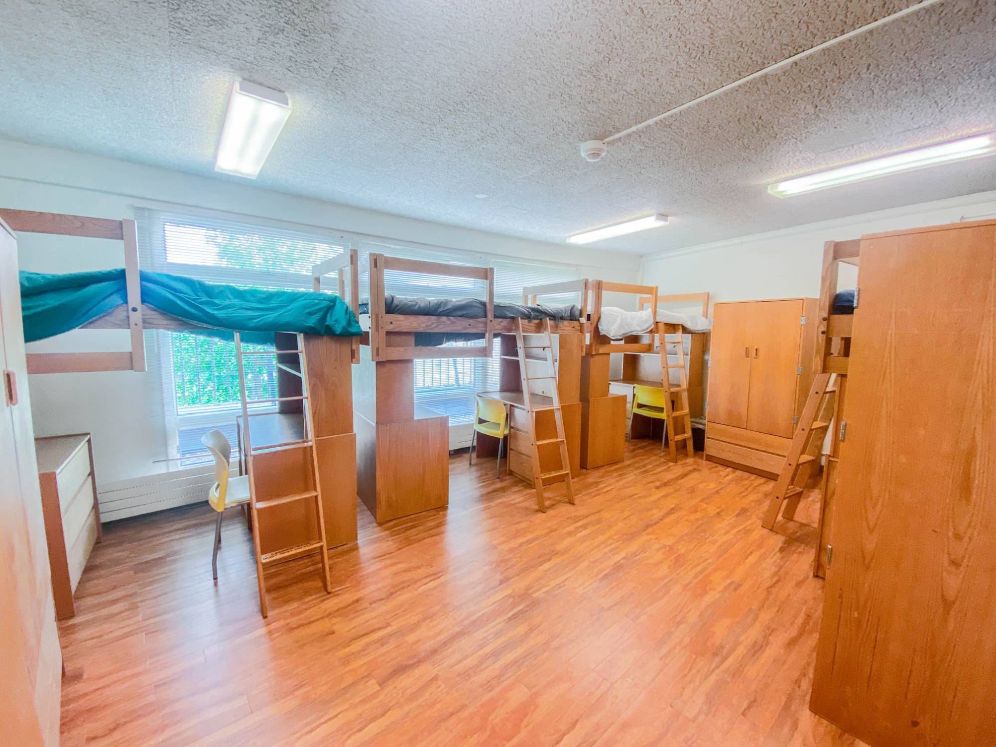 Traditional Quad Floor Plan with four beds, wardrobes, and desks.